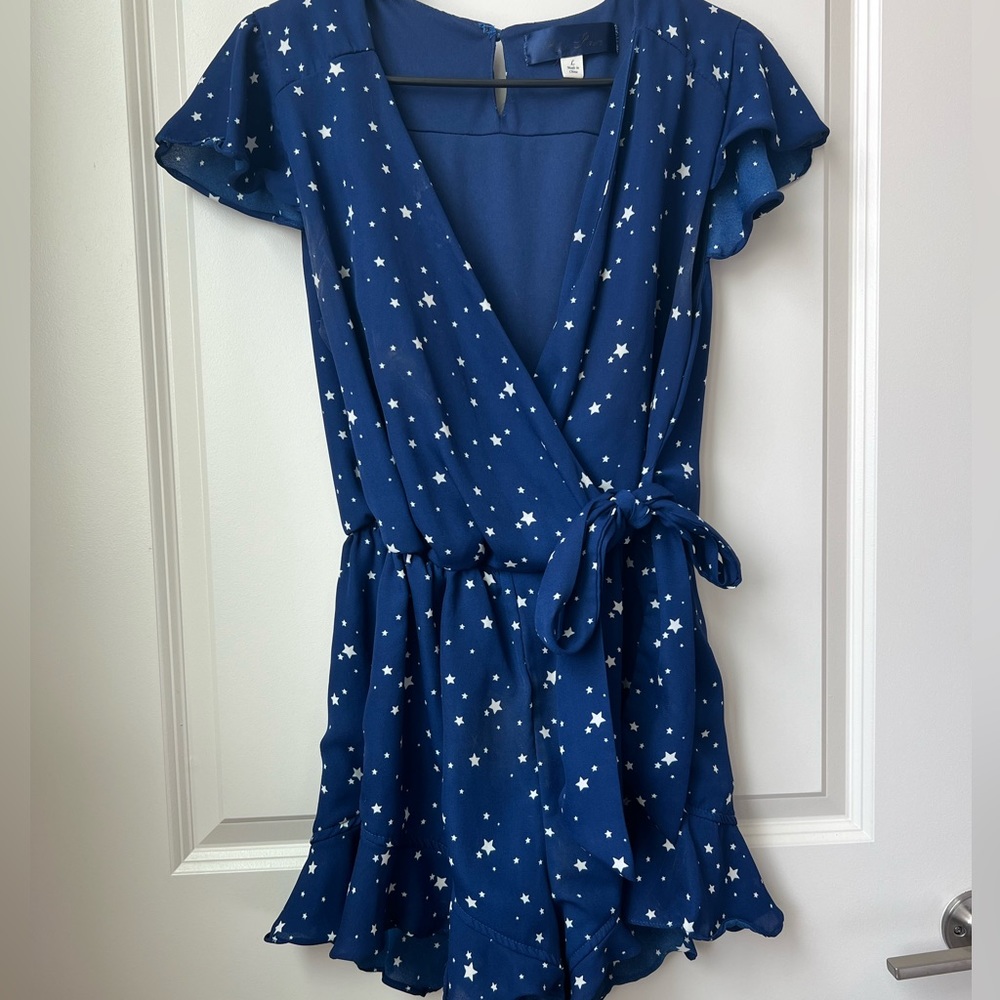 Blue flowy romper with white stars